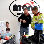 mono motorcycles & vehicle security Proprietor Daniel Morris helping read out raffle winners with Serv Wessex Blood Bike volunteer Rich Hobden