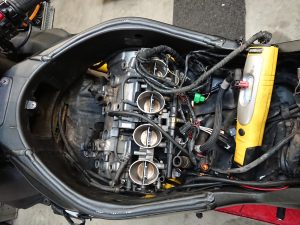  As we have mentioned before, a motorcycle has to undergo some considerable dismantling in the process of a valve clearance check.
