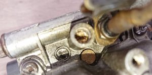 Daniel found that not only were several of the jet screws rounded off, but the air screw had been completed annihilated with a screwdriver.