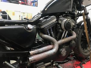 Daniel has already set about the process of re-aligning the exhausts. This has meant removing them form the Harley, cutting a small section off one of them, heating them, bending them & re-shaping.